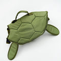 Small dog wearing turtle floatation vest for lake and beach swimming